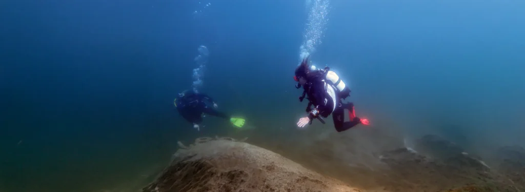 Assistant Instructor Renate and diving student at Blindsee in Austria