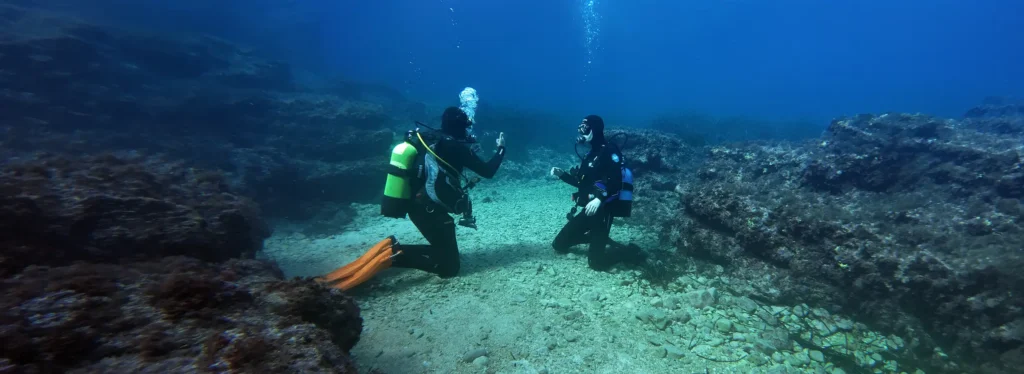 Scuba Diving Instructor Roland Bach of SUP Menorca with a student
