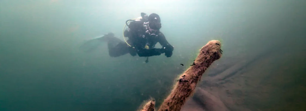 SSI Dive Master Andreas at Plansee, Austria, looking at Tadpoles